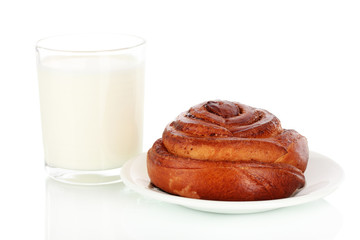 Bread roll and glass of milk isolated on white