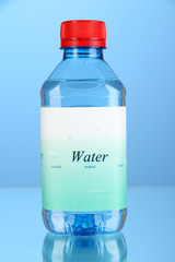 Water bottle with label on blue background