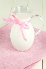 Pitcher of milk on table in room