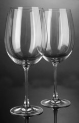 Empty wine glasses arranged on grey background