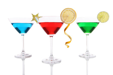 Alcoholic cocktails in martini glasses isolated on white