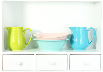 Kitchen utensils on beautiful white shelves