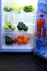 Open refrigerator with vegetarian food