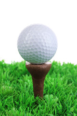 Golf ball on grass isolated on white