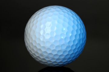 Golf ball on grey background