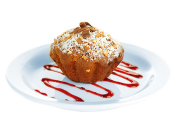 Tasty muffin cake with powdered sugar and chocolate