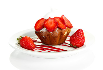Tasty muffin cake with strawberries and chocolate