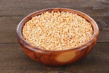 Beans in bowl on wooden background