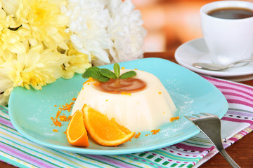 Panna Cotta with orange zest and caramel sauce,