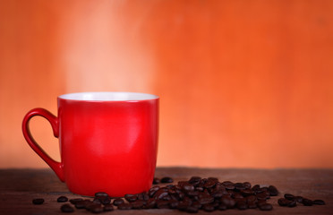 red cup coffee on wood background
