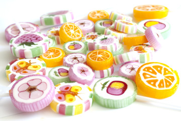 Colorful candy lollipops on white background