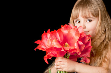 Obraz na płótnie Canvas Little girl with tulips bouquet