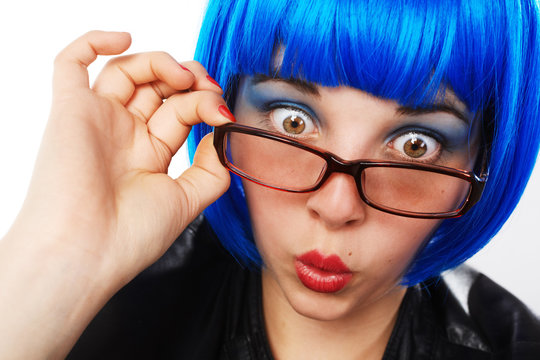 girl with blue wig looking astonished