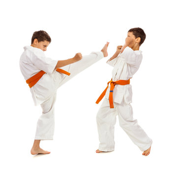 Two boys in white kimono fighting