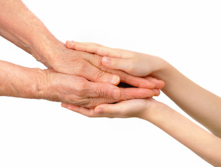 Children's hands embrace old hands