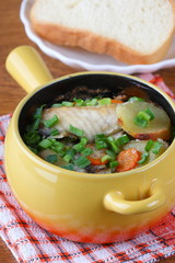 Pieces of fish with vegetables baked in the oven