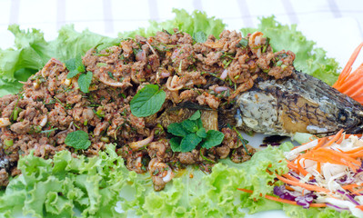 Crispy snake-head fish fried  with spicy salad