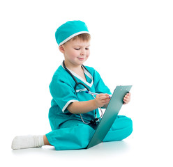 Child boy uniformed as doctor writing to clipboard isolated on