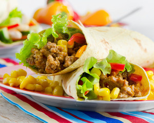 tortilla wraps with meat and fresh vegetables