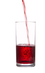 Stream of juice flows in a glass