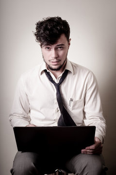 stressed businessman using notebook