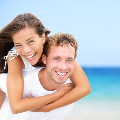 Happy couple on beach summer fun vacation