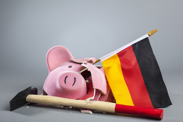 Robbed piggy bank of Germany with hammer