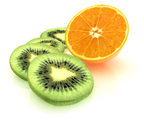 Fototapeta premium slices of kiwi and half orange on a white
