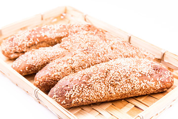 Freshly baked bread rolls with sesame