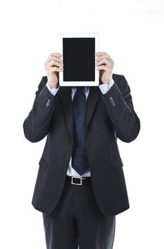 businessman holding Ipad in front of his head