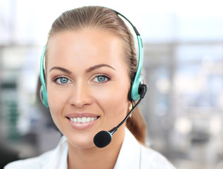 Female customer support operator with headset and smiling