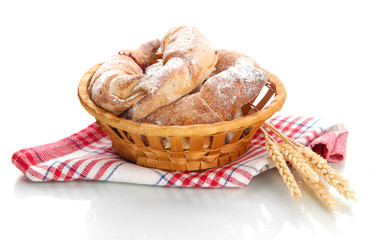Taste croissants in basket isolated on white.