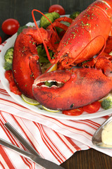 Red lobster on platter on table close-up