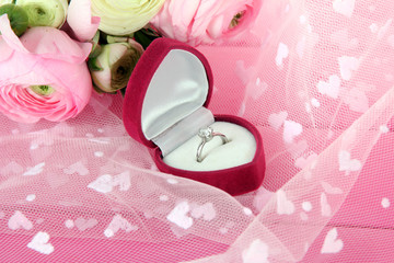 Ranunculus (persian buttercups) and engagement ring,