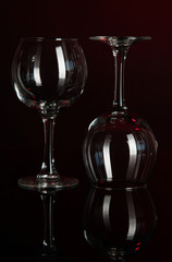 Obraz na płótnie Canvas Two glasses on dark red background