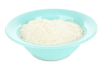 Powdered milk in bowl for baby isolated on white