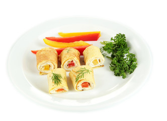 Egg rolls with cheese cream and paprika,on plate, isolated