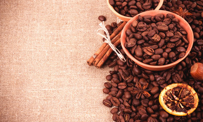 Cup of coffee on coffee beans and nut