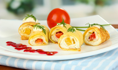 Egg rolls with cheese cream and paprika,on plate,