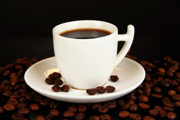 Cup of strong coffee isolated on black