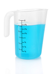 Measuring cup with blue liquid isolated on white