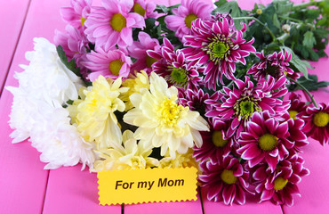 Bouquet of beautiful chrysanthemums on table close-up