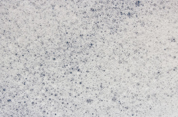 A closeup macro texture of soap sud bubbles