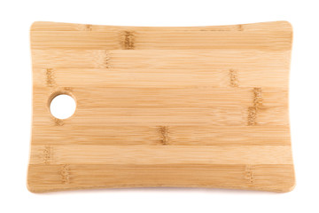 Wooden cutting board over white background
