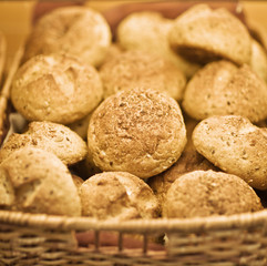 assortment of baked bread in basket. series