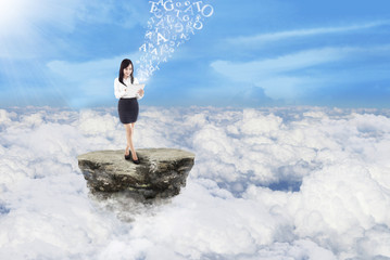 Businesswoman send message on clouds