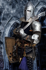 Fototapeta na wymiar Armed knight is guarding some castle