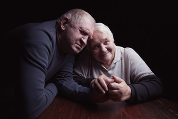 Fototapeta premium happy older pair on a black background