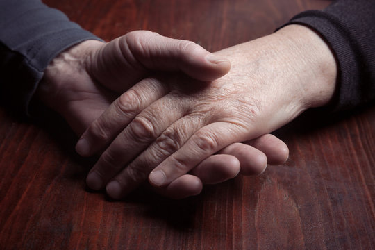 Hands elderly men and women