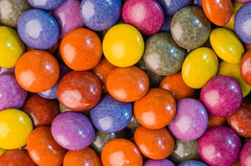 Colorful chocolate candies on table
